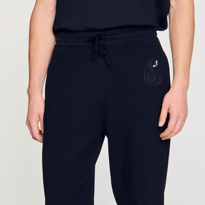 Joggers with snake detail | Sandro