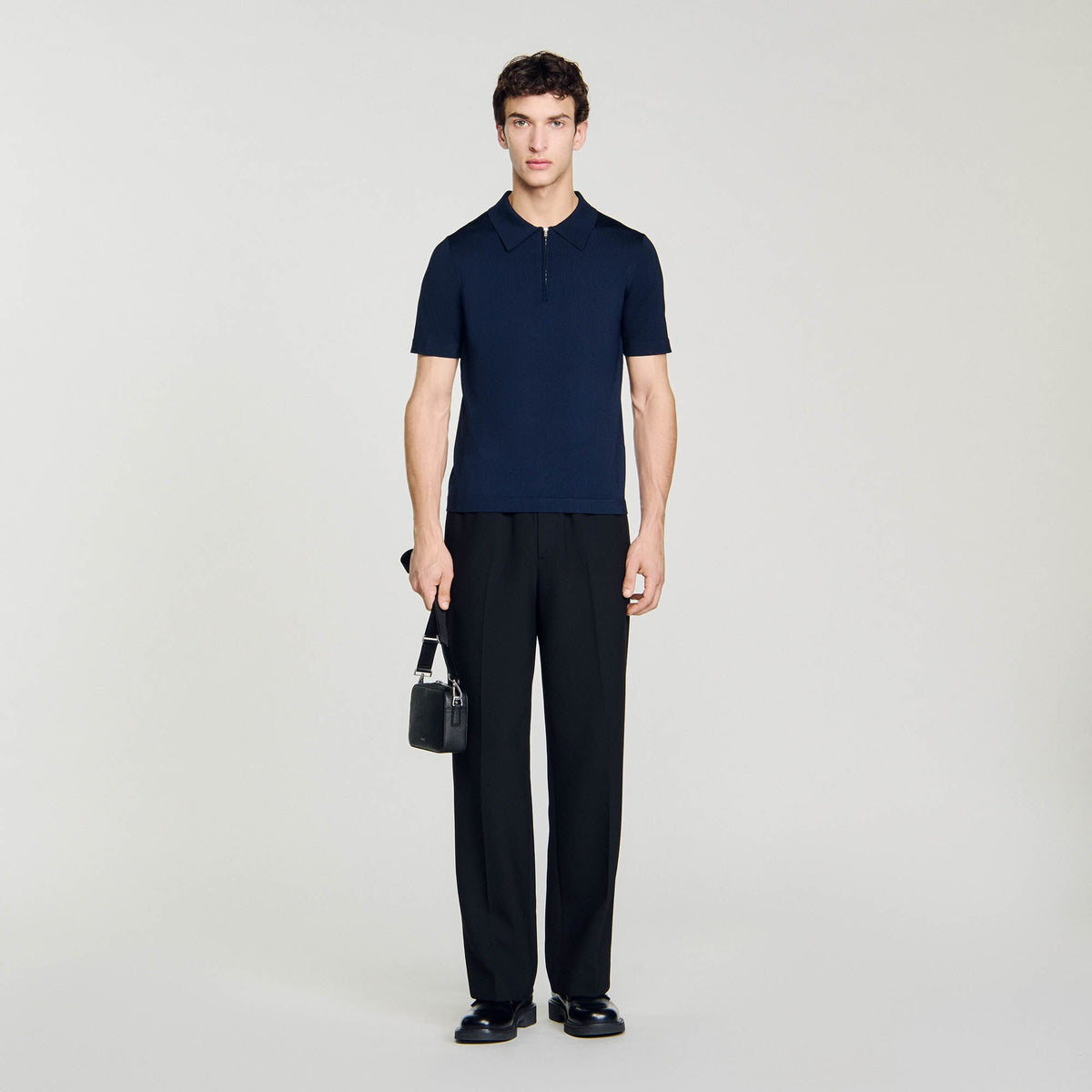 Knitted polo shirt with zip collar | Sandro