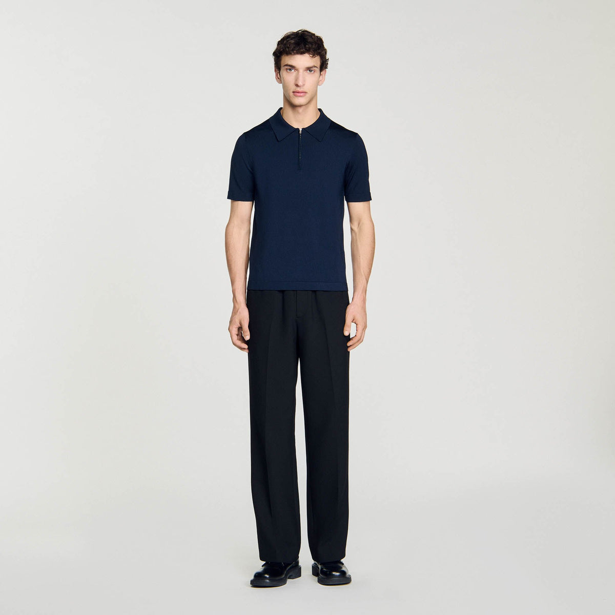Knitted polo shirt with zip collar | Sandro