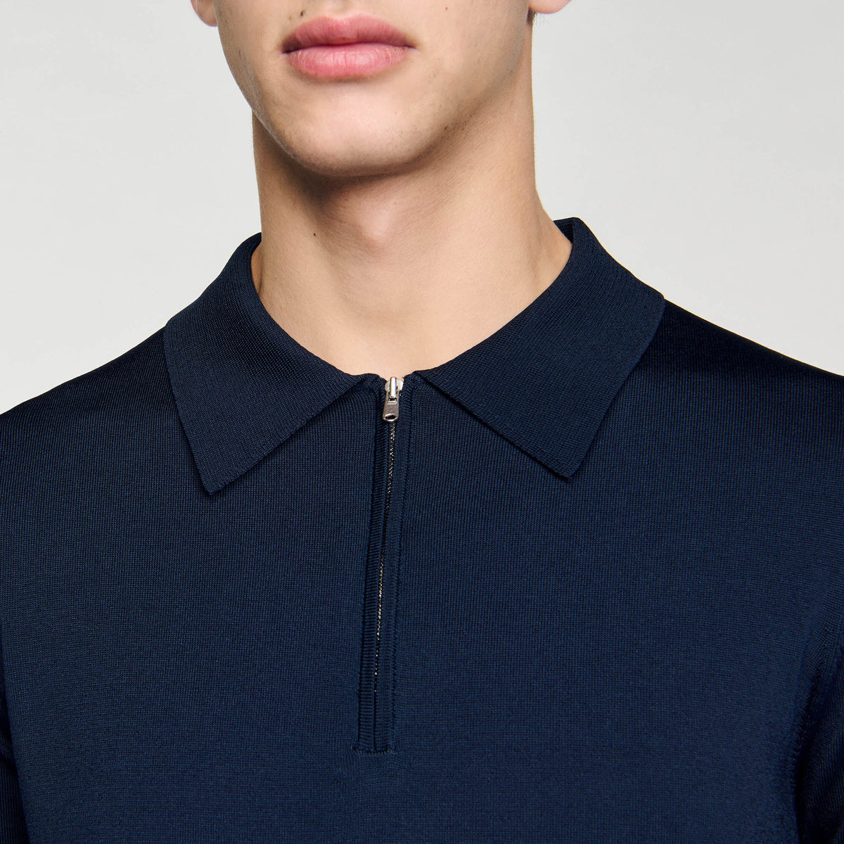 Knitted polo shirt with zip collar | Sandro