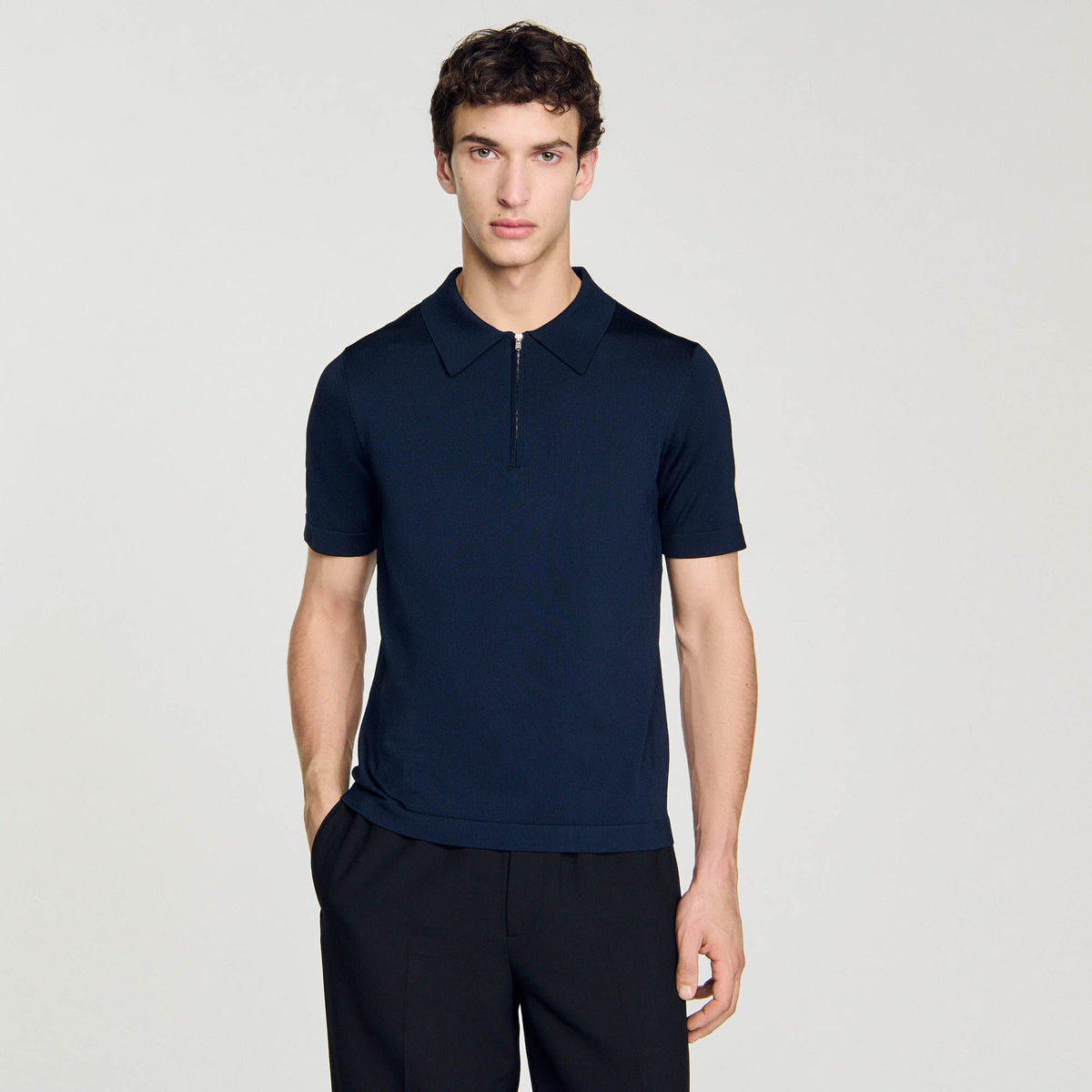 Knitted polo shirt with zip collar | Sandro