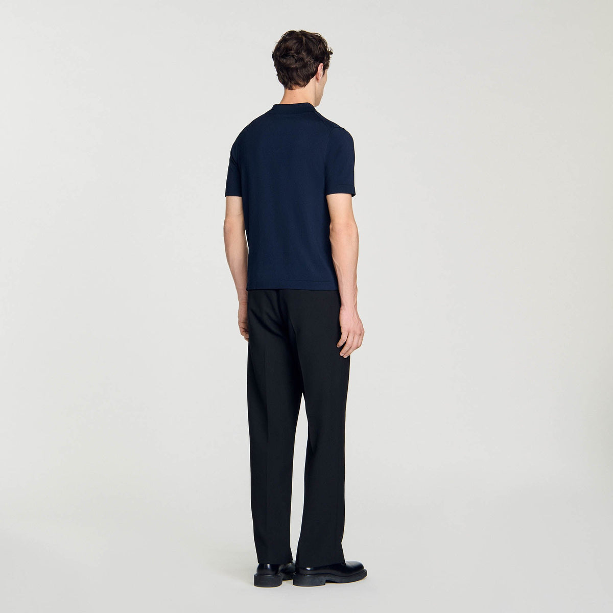 Knitted polo shirt with zip collar | Sandro