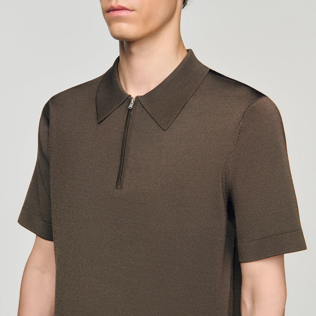 Knitted polo shirt with zip collar | Sandro