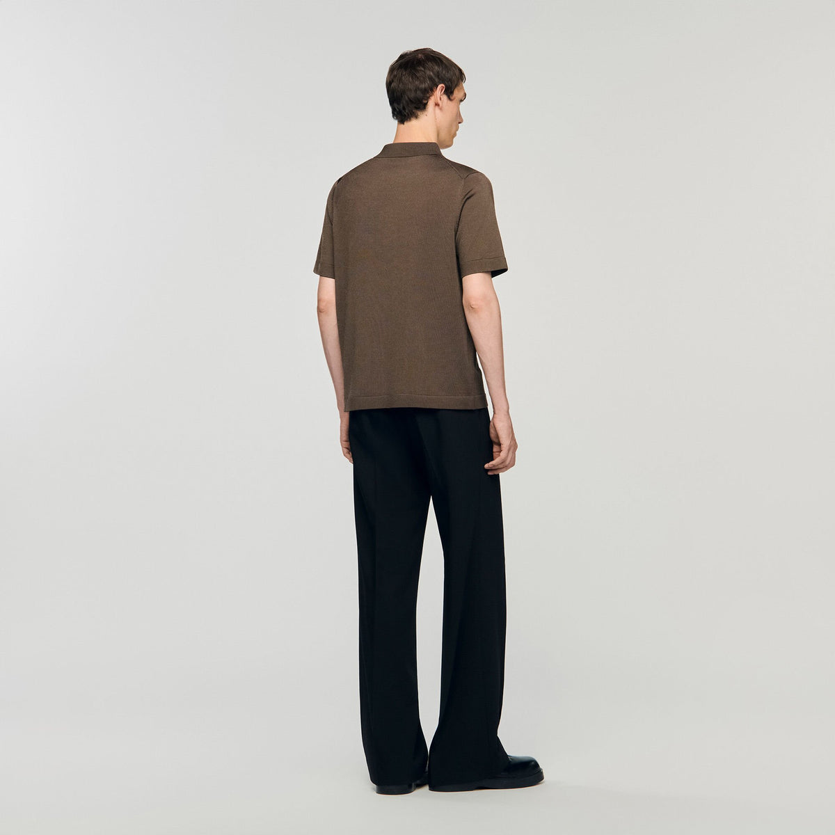 Knitted polo shirt with zip collar | Sandro
