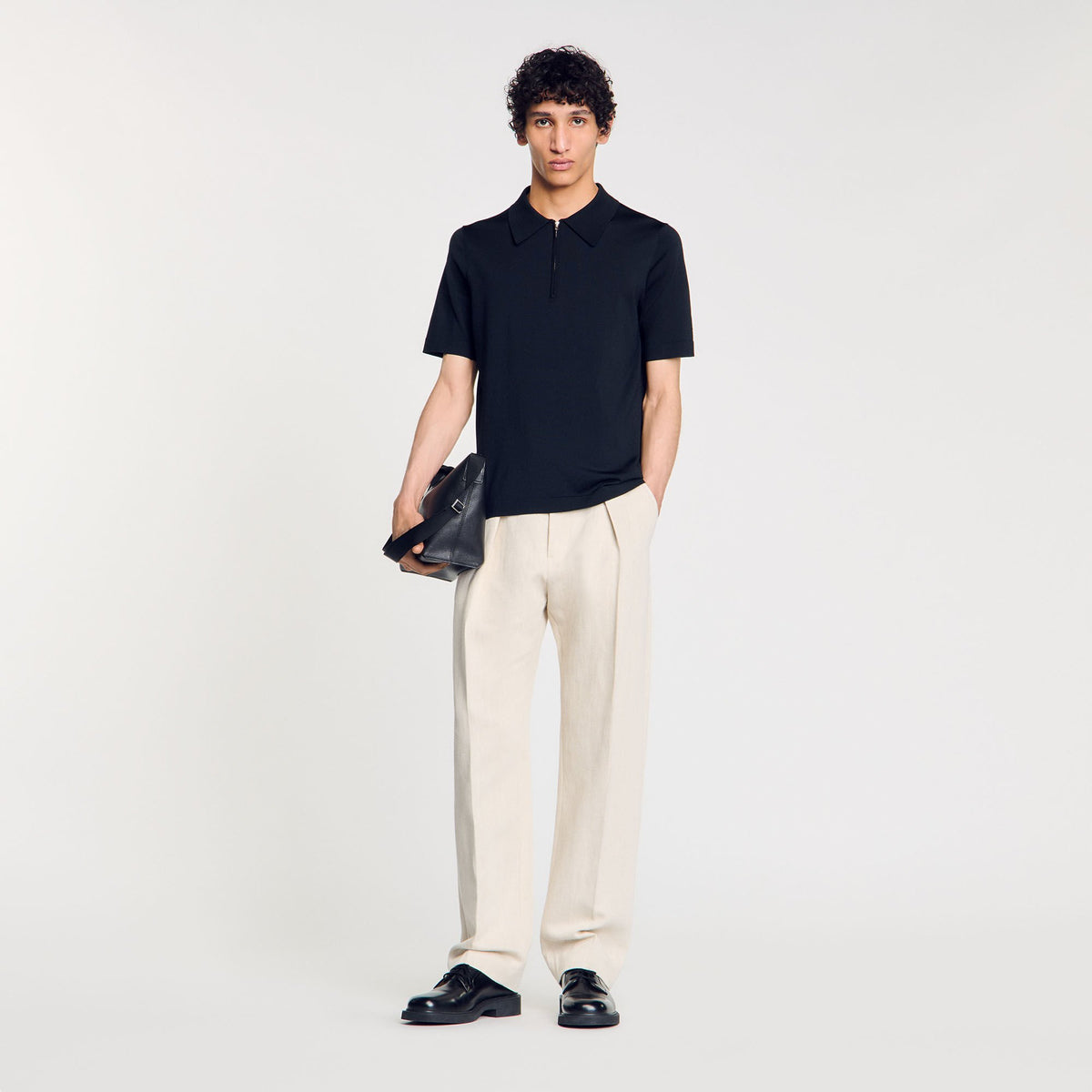 Knitted polo shirt with zip collar | Sandro