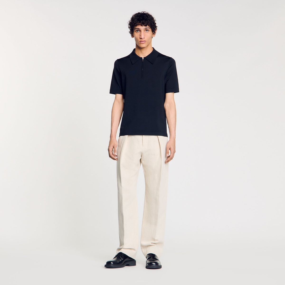 Knitted polo shirt with zip collar | Sandro
