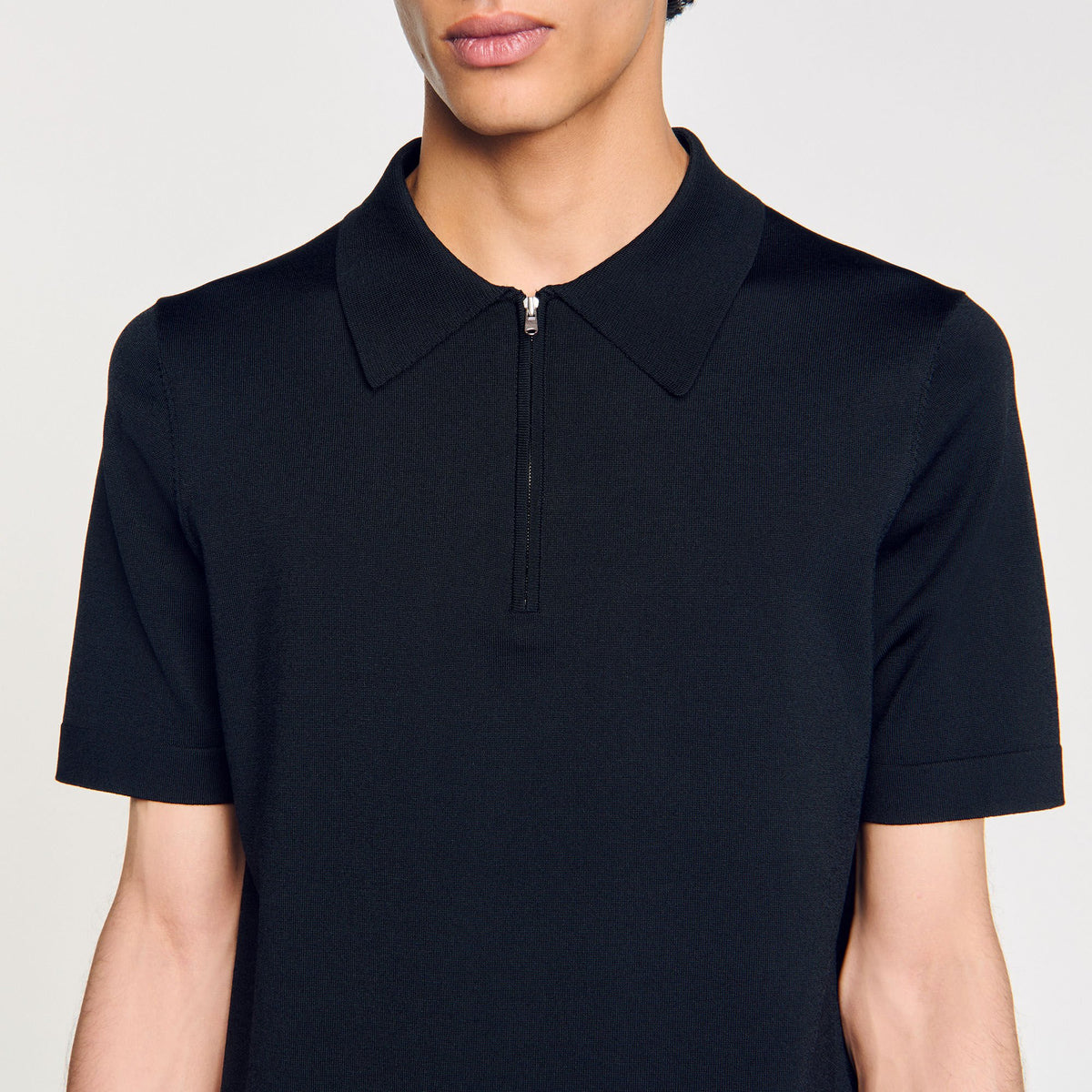 Knitted polo shirt with zip collar | Sandro
