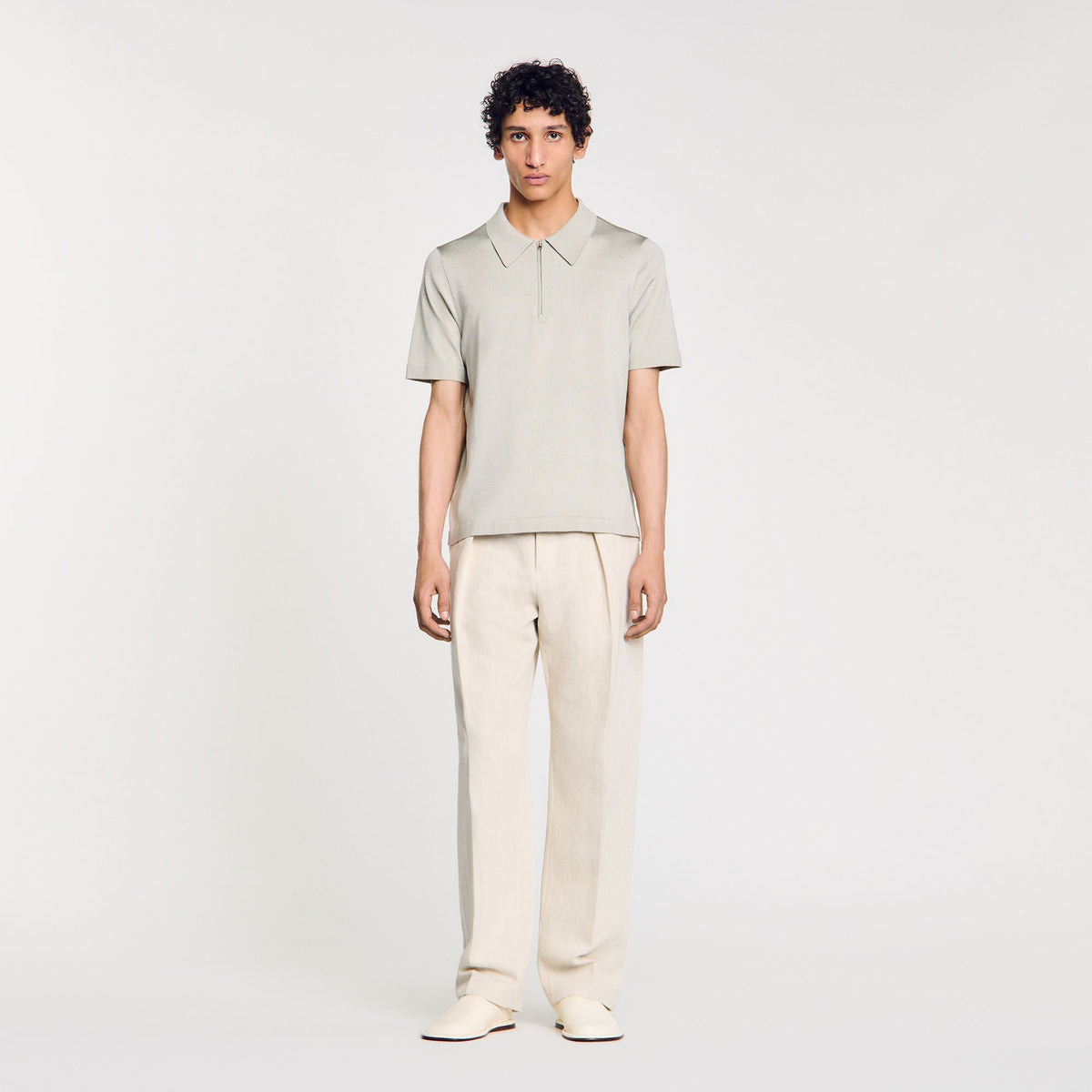 Knitted polo shirt with zip collar | Sandro