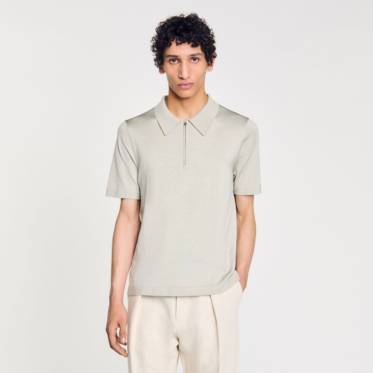 Knitted polo shirt with zip collar | Sandro