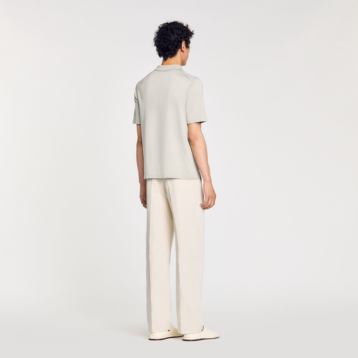 Knitted polo shirt with zip collar | Sandro